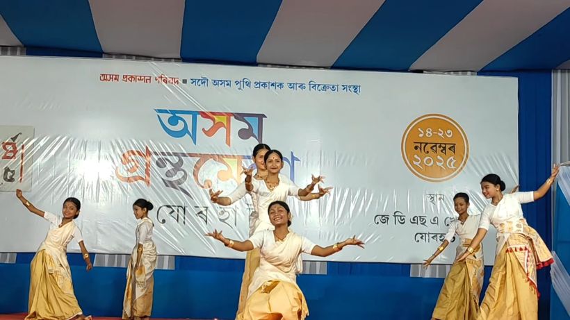 Girls dancing with arms raised
