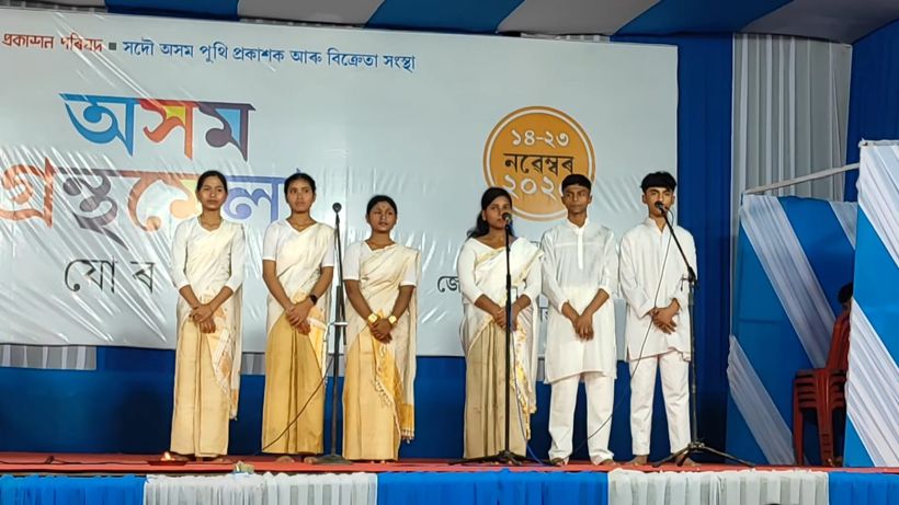 A choir of students in white