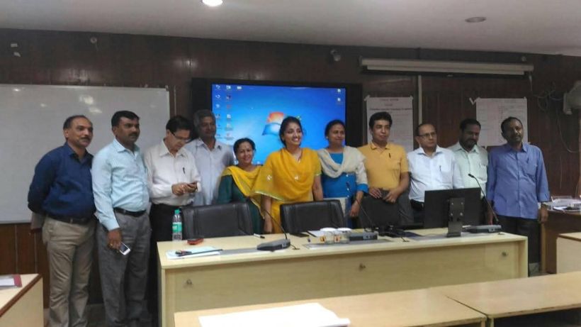 A group of educators standing in a conference room in New Delhi